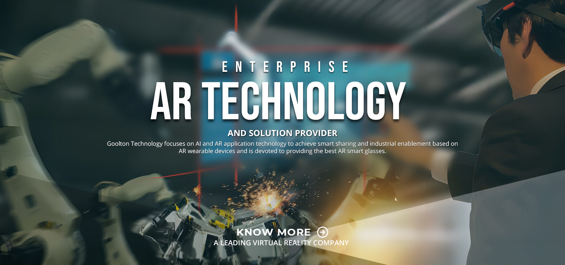 Enterprise engineer wearing AR glasses beside automated robotics line.